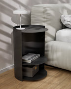 Black metal nightstand used as side table beside sofa