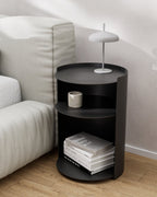 Black metal nightstand used as side table beside sofa