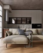 white metal side table placed between sofa sections