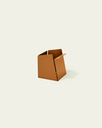 Orange metal pen holder with folded front edge