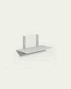 White modular metal shelf on light background