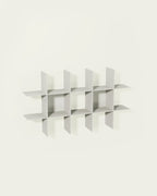 White modular wall shelf on light background