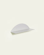 White round metal wall shelf on light background