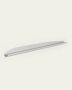 White slim metal wall shelf on light background