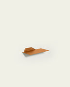 Terracotta slim metal wall shelf 30 cm on light background