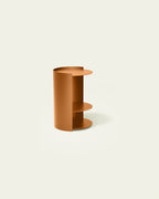 Terracotta metal nightstand on light background